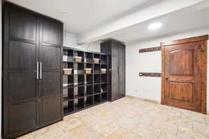 Mudroom featuring baseboards and recessed lighting