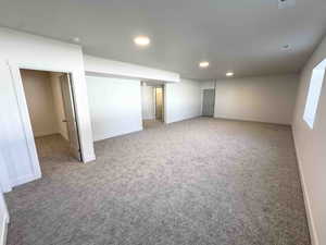 Finished below grade area with carpet and recessed lighting