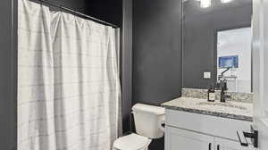 Bathroom featuring vanity and a shower with curtain