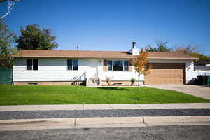 Single story home with concrete driveway, a garage, roof with shingles, and crawl space