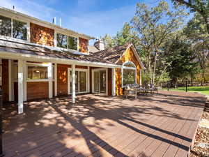 Wooden terrace with an outdoor hangout area.