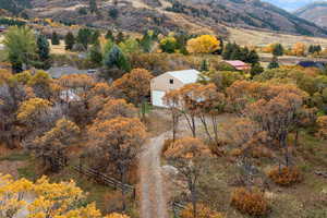 View of rural area with a tree filled landscape and a mountain backdrop