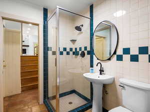 3/4 bathroom just inside from garage entrance and billiard room.