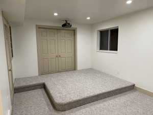 Bedroom featuring carpet floors, a closet, and recessed lighting