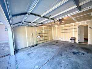 Garage featuring a garage door opener