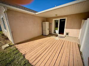 Wooden deck featuring a patio