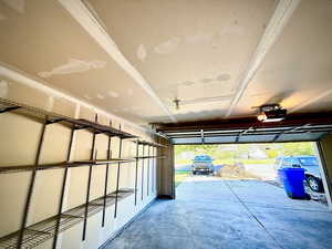 Garage featuring a garage door opener