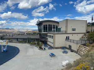 Back of house featuring stucco siding and a mountain view