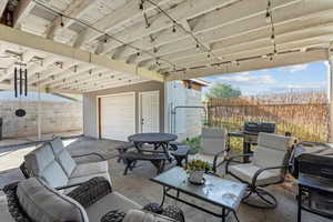 Fenced backyard with a patio area, area for grilling, an outdoor hangout area, and outdoor dining space