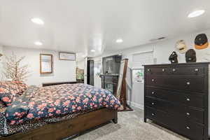 Bedroom featuring light colored carpet and recessed lighting