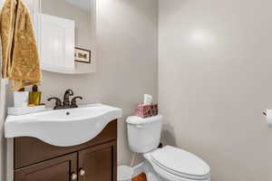 Half bath with vanity and toilet
