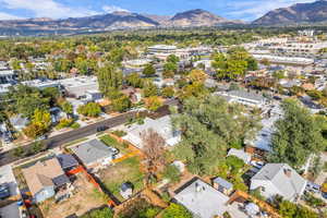 Aerial perspective of suburban area featuring a mountain backdrop