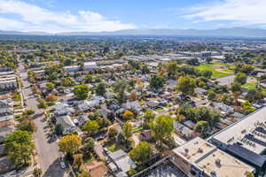 Aerial perspective of suburban area featuring a mountain backdrop
