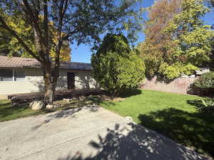 View of side of home with a metal roof