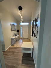 Entryway featuring light wood-type flooring and baseboards