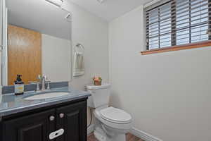 Bathroom featuring vanity and wood finished floors