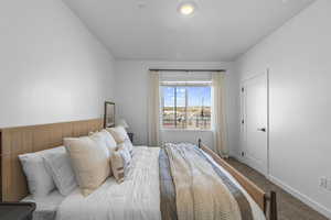 Bedroom with carpet flooring and baseboards