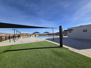 View of yard featuring a patio and a community pool