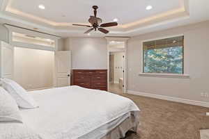 Master Bedroom featuring a raised ceiling, carpet floors, ceiling fan, and recessed lighting
