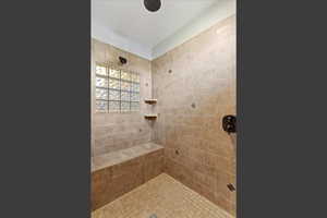 Master bathroom featuring a tile shower