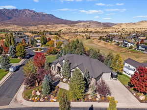 Aerial perspective of suburban area featuring a mountain backdrop