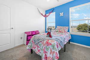 Bedroom featuring carpet flooring and ceiling fan