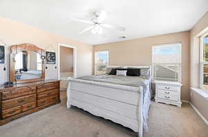 Bedroom featuring light colored carpet and ceiling fan