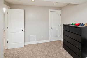Unfurnished bedroom featuring carpet flooring and recessed lighting