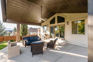 View of patio / terrace featuring an outdoor living space, ceiling fan, and grilling area
