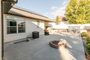 Fenced backyard featuring a patio and an outdoor fire pit