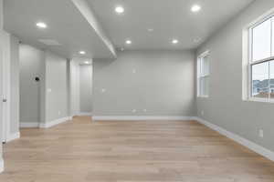 Spare room featuring recessed lighting and light wood-style flooring