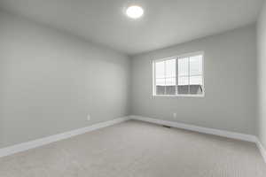 Empty room featuring carpet floors