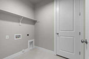 Laundry room featuring light tile patterned floors, hookup for a washing machine, electric dryer hookup, and gas dryer hookup