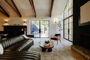 Living room with wood finished floors and french doors