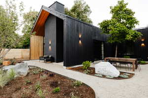 View of property exterior featuring a patio