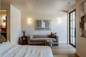 Bedroom featuring wood finished floors and baseboards