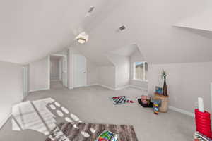 Rec room with carpet and lofted ceiling