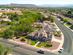 Aerial perspective of suburban area featuring a mountain backdrop