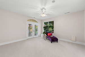 Unfurnished room with french doors, carpet, and ceiling fan