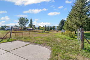 View of yard with a rural view