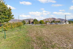 View of yard featuring a mountain view and a rural view