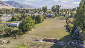 Overview of rural landscape featuring abundant farmland and a mountainous background