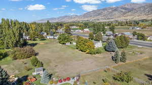 Overview of rural landscape featuring a mountainous background