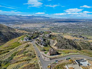 Aerial view of residential area featuring a mountainous background