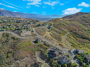 View of property location featuring a mountainous background and nearby suburban area