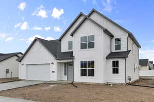 Modern inspired farmhouse featuring board and batten siding, roof with shingles, concrete driveway, and an attached garage
