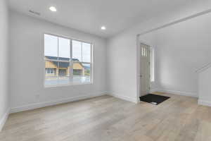 Foyer entrance featuring recessed lighting and light wood-style flooring