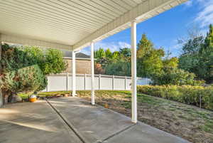 Fenced backyard with a patio area