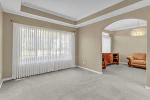 Light-filled front room that flows into a flexible dining or office space.