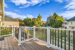 Wooden deck with a residential view